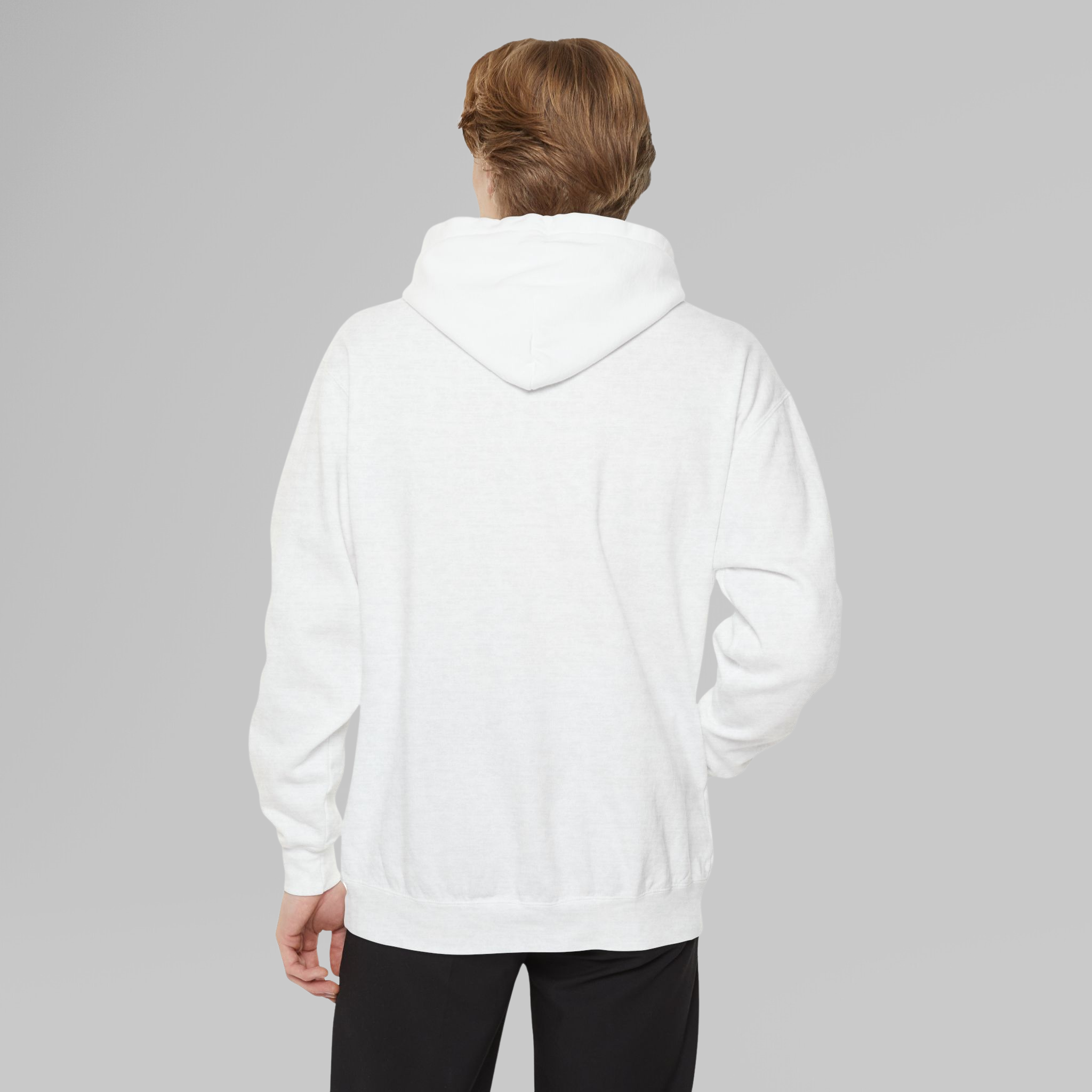 Person wearing a white hoodie on a gray background