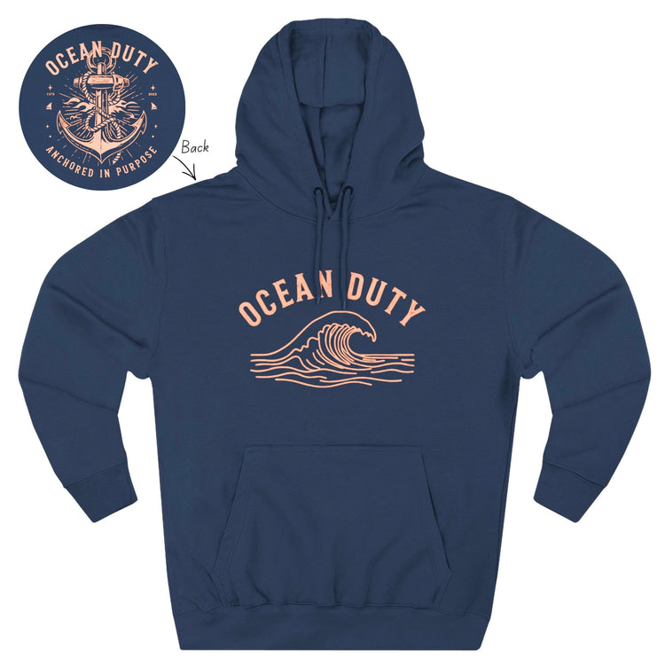 Dark navy blue hoodie with a light colored arching "OCEAN DUTY" text and rolling wave line graphic on the front, with a circular cutout detailing the anchor graphic for the back.