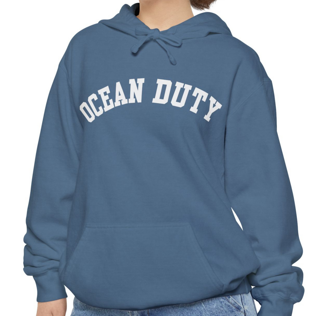 model wearing blue hoodie with ocean duty words printed