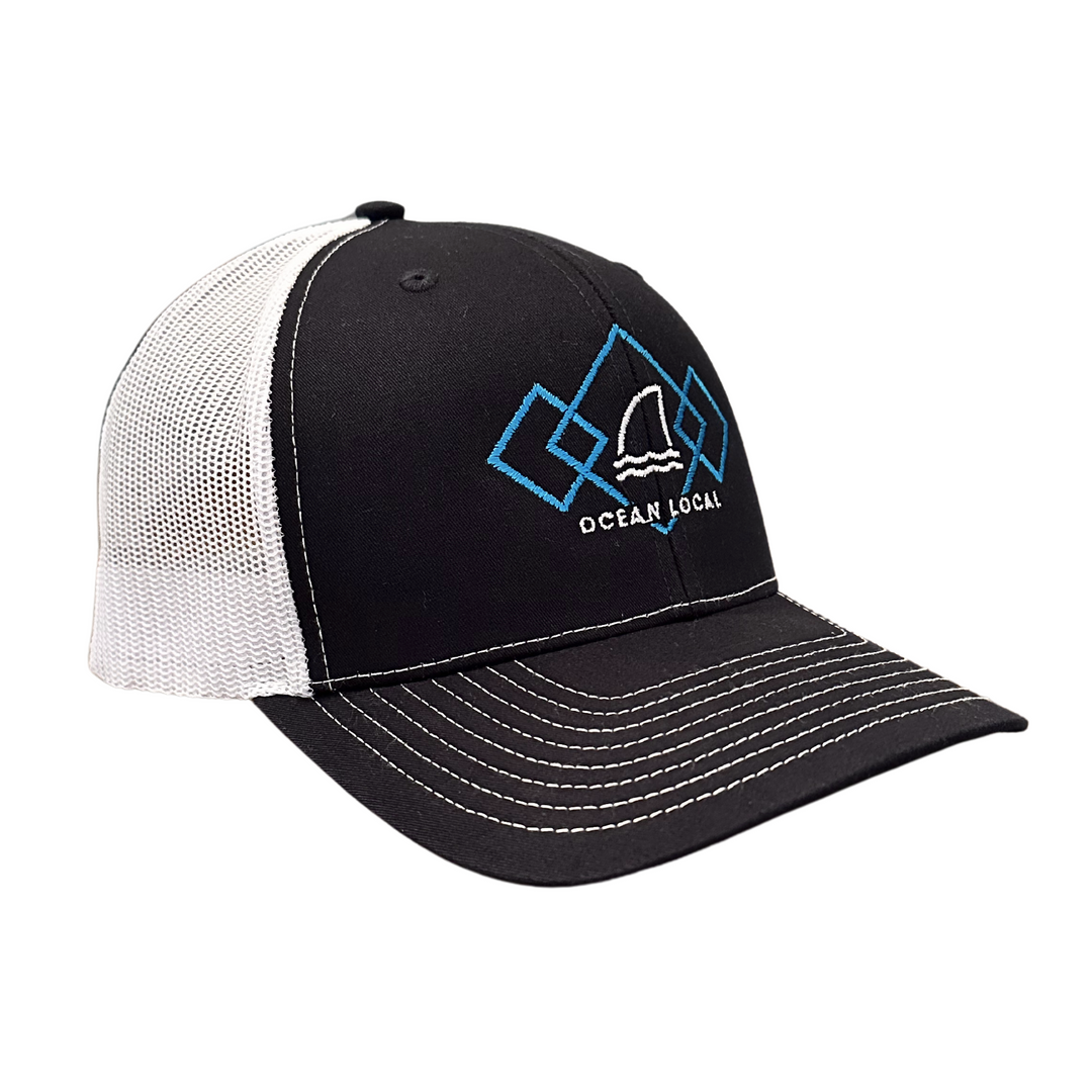 Trucker Hat by Ocean Duty with colorful graphic that includes a shark dorsal fin front ride side