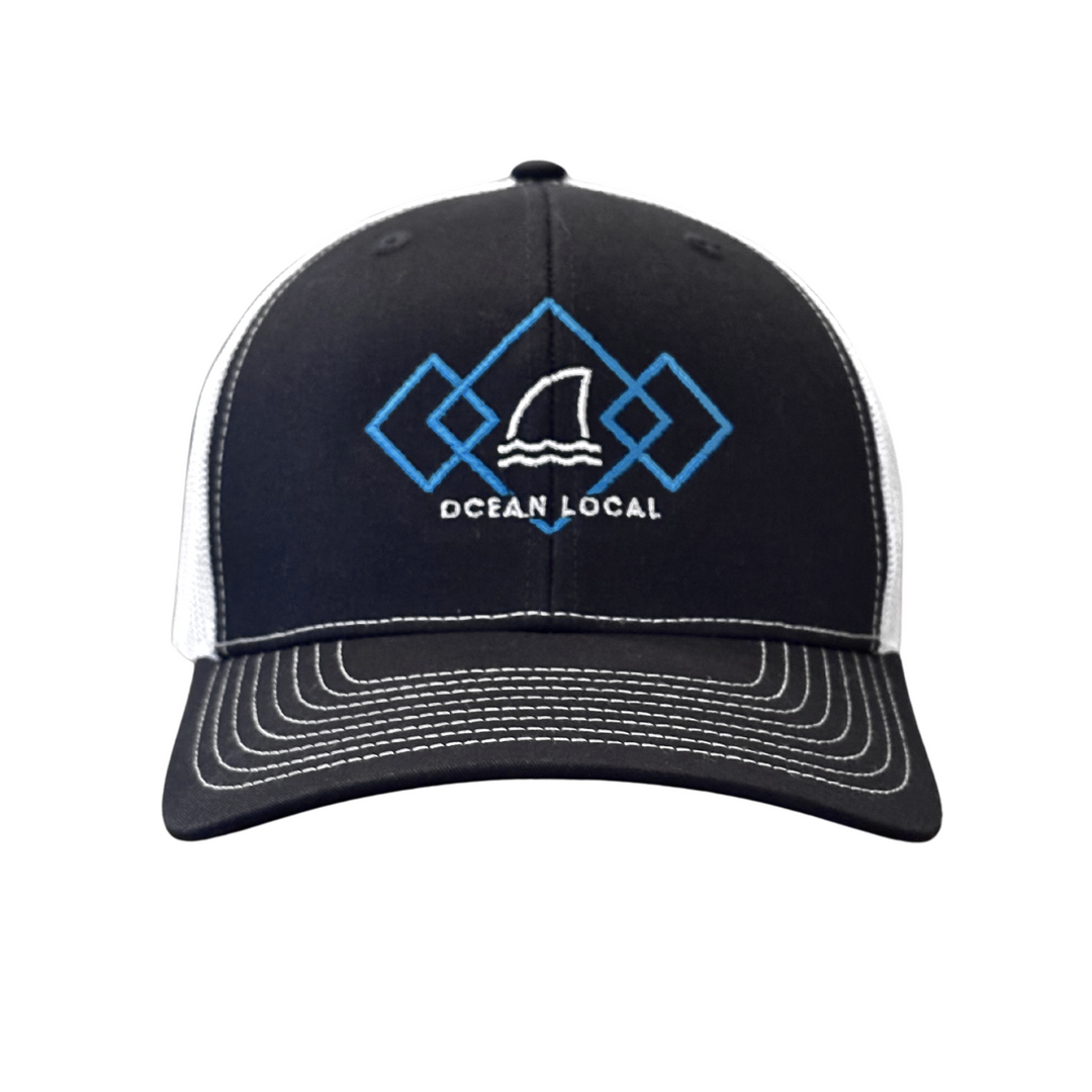 Trucker Hat by Ocean Duty with colorful graphic that includes a shark dorsal fin facing straight forward