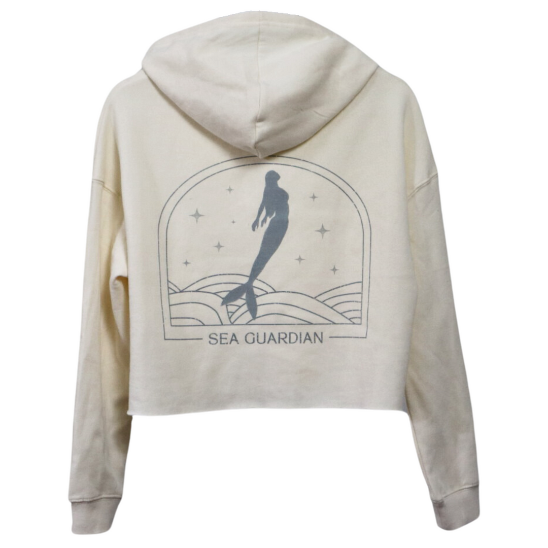 The back of a cropped bone white hoodie with a gorgeous mermaid graphic.