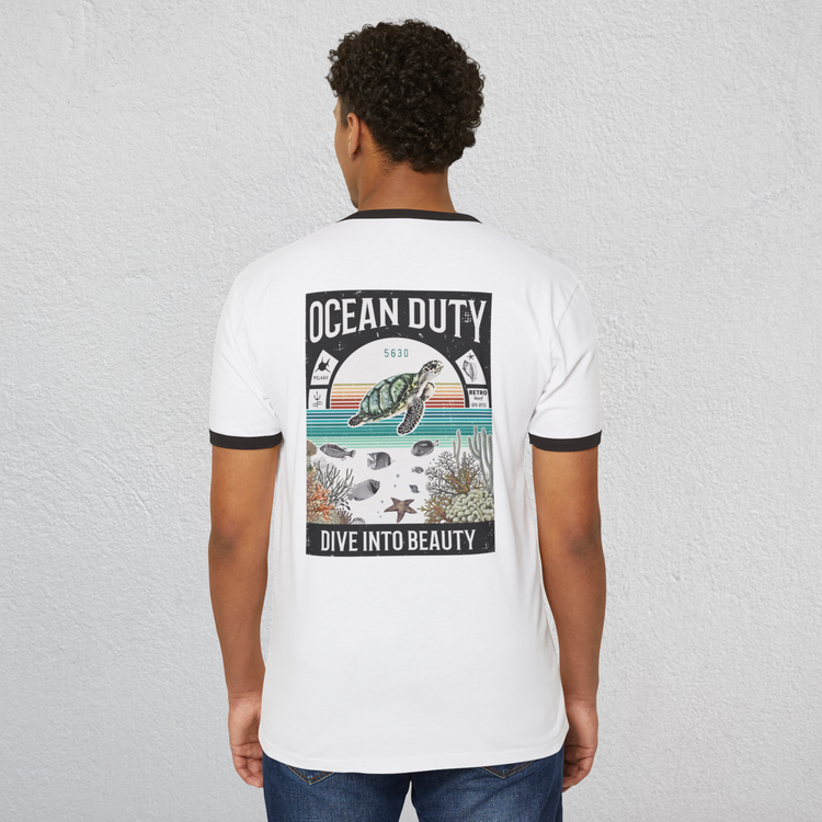 A man wearing a ringer t-shirt with a vintage distressed ocean poster on the back