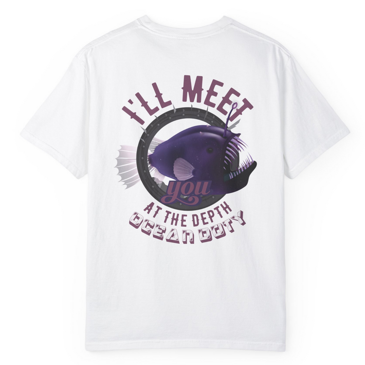 A white t-shirt with a vibrant purple deep sea fish referring to the ocean's depth.
