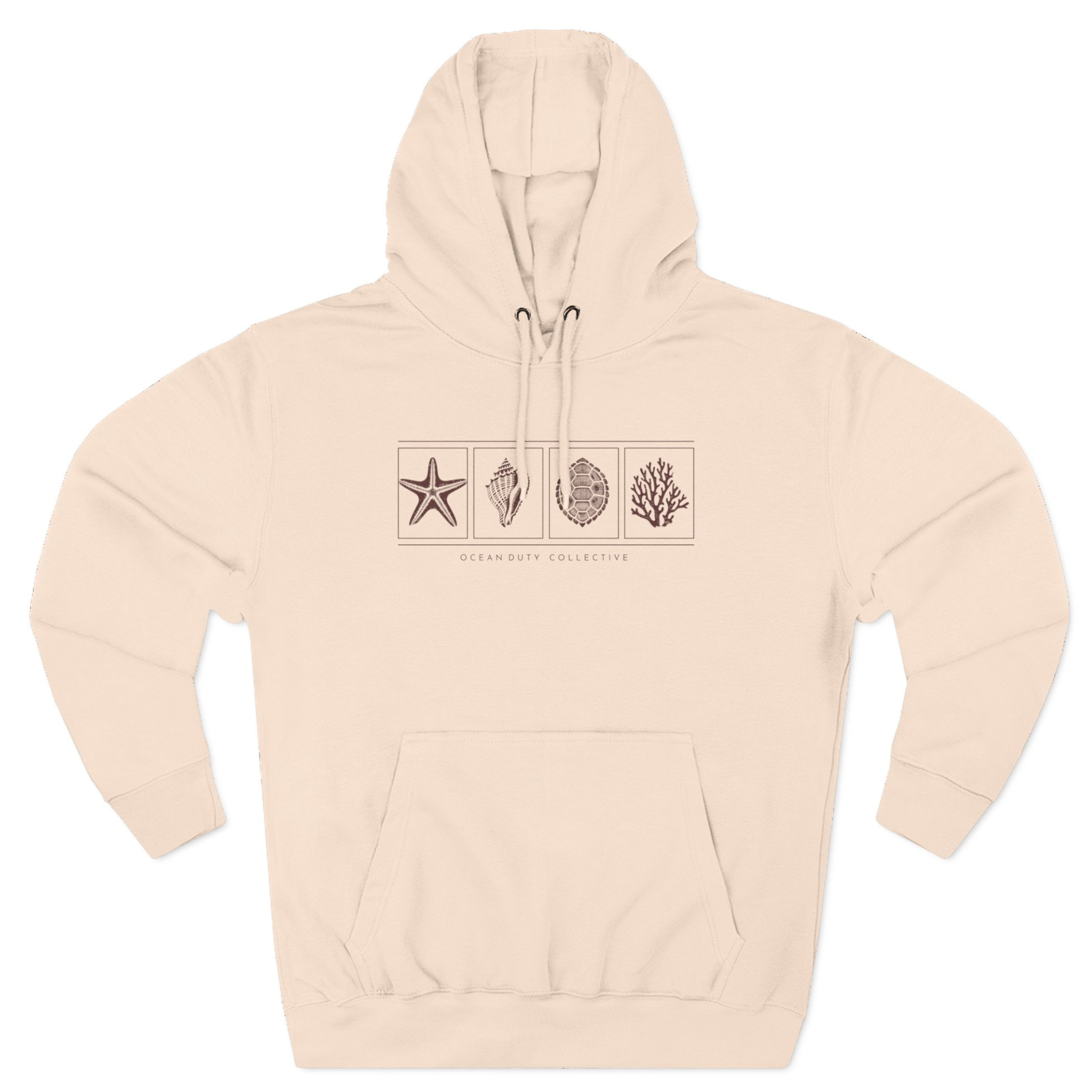 A model wearing the premium Ocean Duty Collection Hoodie in Pale Pink, styled casually for a coastal lifestyle look.