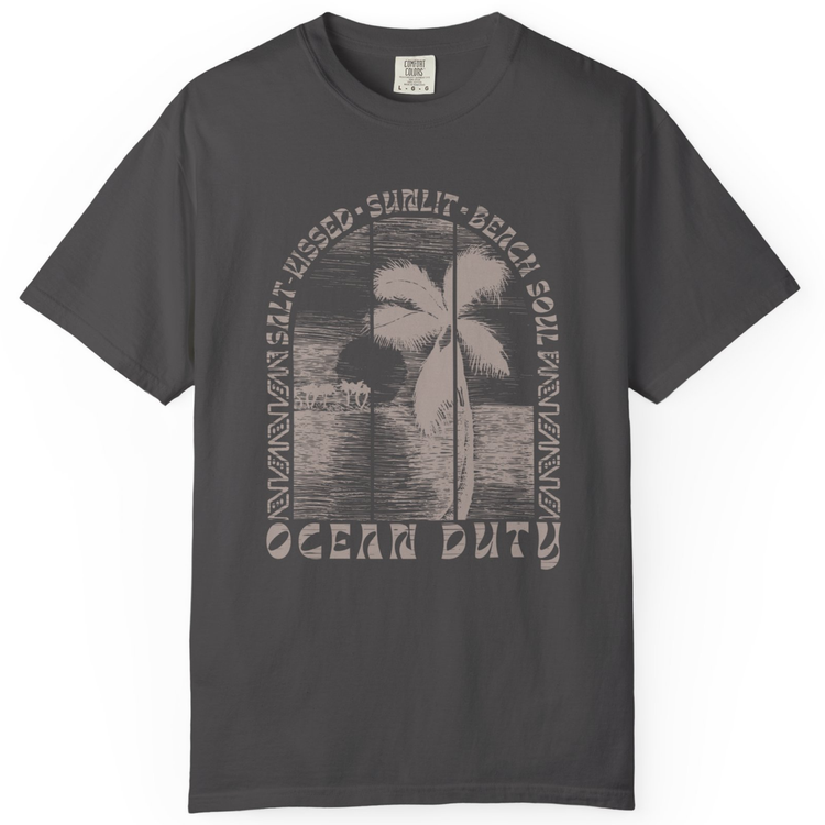 A dark charcoal gray short-sleeve t-shirt with a vintage-style distressed graphic on the front. The graphic features a palm tree silhouette over a beach scene, surrounded by the words 'SALT KISSED, SUNLIT, BEACH SOULD, and 'OCEAN DUTY' in an arched layout.